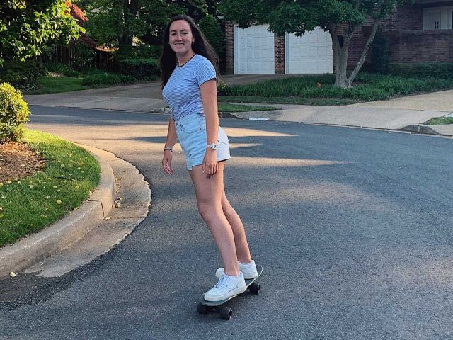 Isabel longboarding.